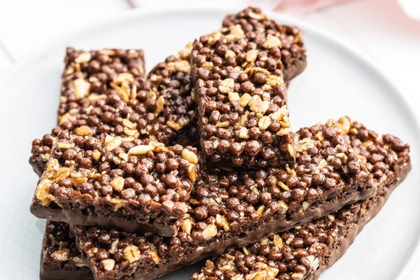 Chocolate cereal bars. Tasty protein bars on plate.